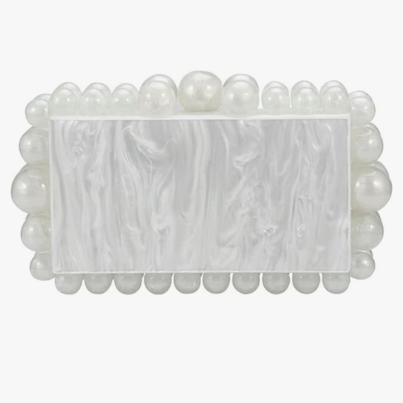 Pearly Acrylic clutch… love it but ready to rotate.